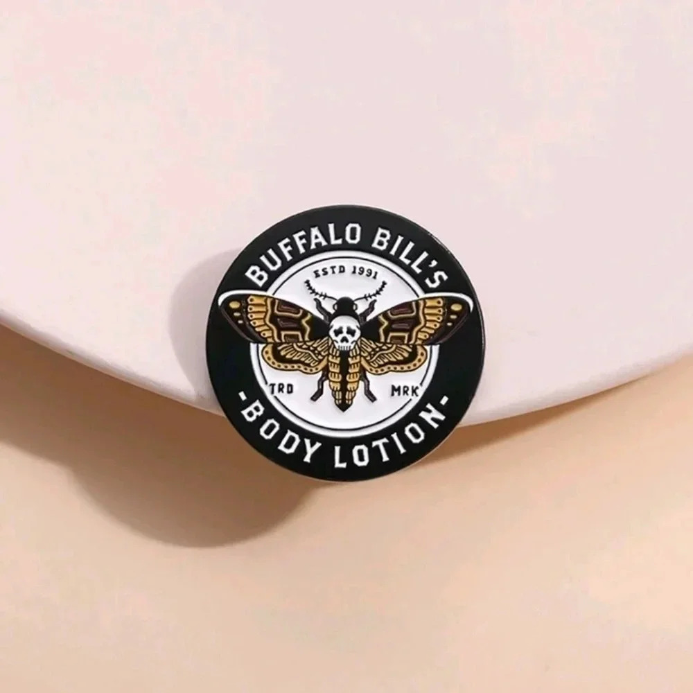 Skull moth buffalo bills body lotion spooky enamel pin goth witch style yellow